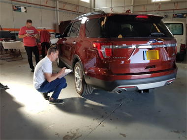 Ford Explorer with engineers